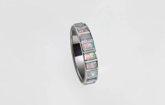 Opal jewelry by Mogano — Opal birthstone jewelry - gold and silver opal rings, huggies, and charms designed for everyday wear and sensitive skin.