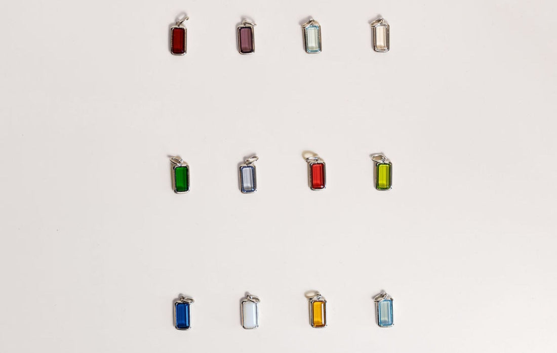 The Symbolism Behind Birthstone Charms — Mogano Personalized Jewelry Guide, birthstone charms meaning, personalized jewelry, gemstone symbolism