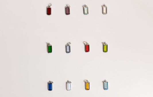 The Symbolism Behind Birthstone Charms — Mogano Personalized Jewelry Guide, birthstone charms meaning, personalized jewelry, gemstone symbolism