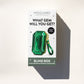 Mogano Jewelry & Accessories 'What Gem Will You Get?' blind box packaging, featuring a green emerald-shaped gem illustration on a white box with a dark green base, photographed on a light beige background with a strong shadow.