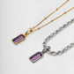 Two necklaces with amethyst purple gemstone pendants on gold and silver chains against a white background
