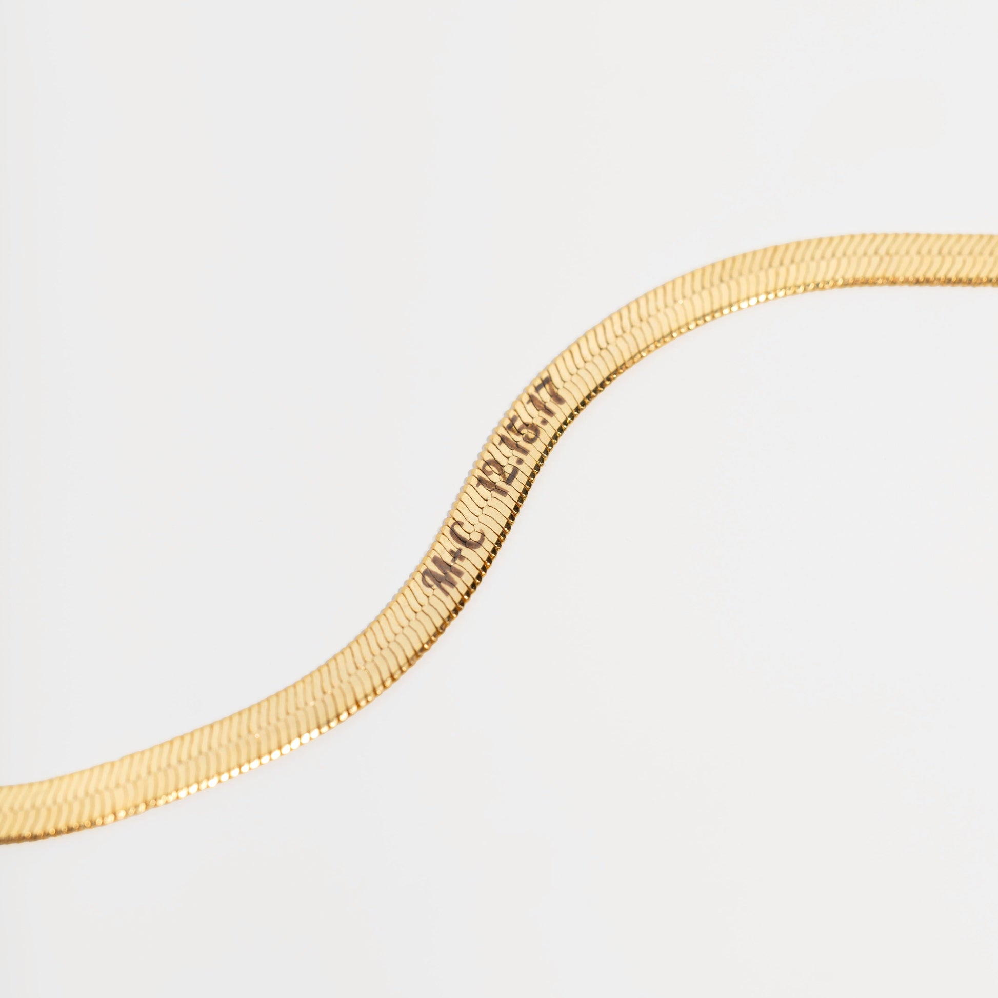 Engraving on gold herringbone chain
