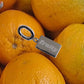 Keychain labeled 'fruity' among oranges