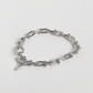 Silver chain bracelet on a white background