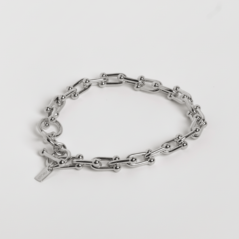 Silver chain bracelet on a white background